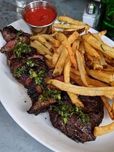 Satis Bistro signature dishes Steak FritesMushroom GnocchiCharcuterie and Cheese Boards